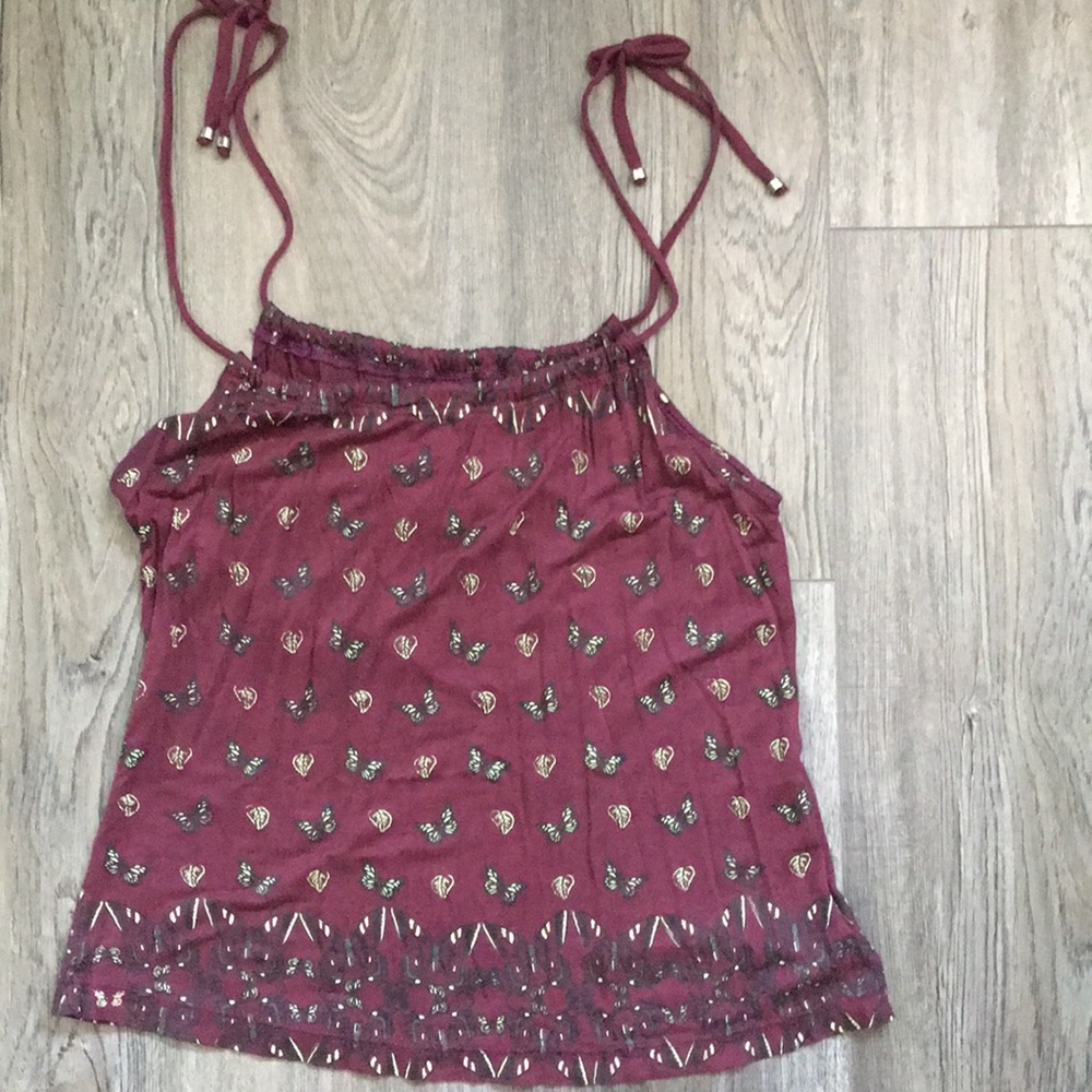 Purple top with butterfly details